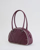 Immagine della borsa bowler in crema e borgogna
