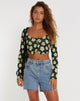 Immagine di Faline Crop Top in giallo e nero con motivo floreale.