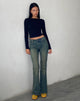 Immagine dei jeans svasati a vita bassa in lavaggio verde