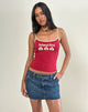 Immagine di Solani Top in rosso adrenalinico con rilegatura in pietra e grafica Island Girl
