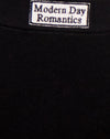 Etichetta nera con etichetta Modern Day Romantics Embro