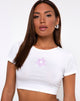 Immagine di Tindy Top in bianco con ricamo margherita lilla