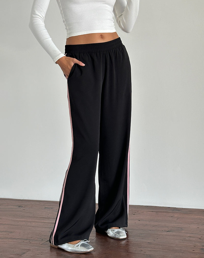 Immagine dei pantaloni Bennett in nero con strisce laterali rosa