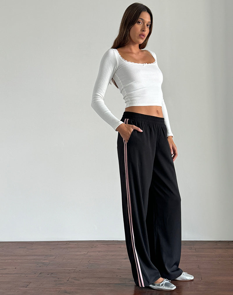 Immagine dei pantaloni Bennett in nero con strisce laterali rosa