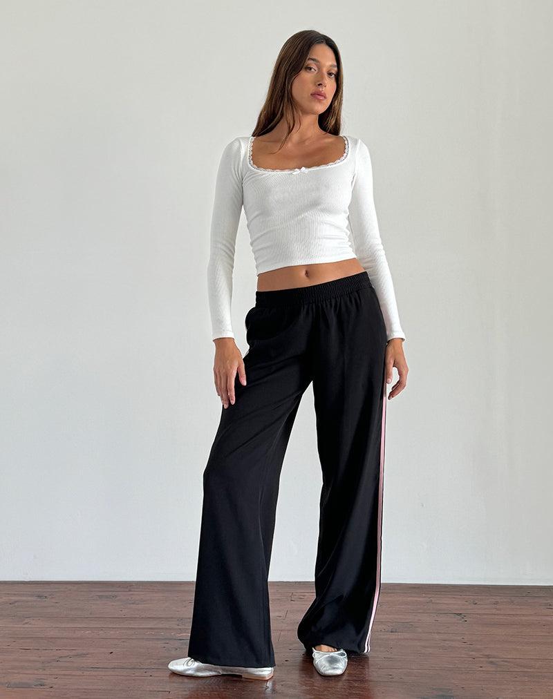 Immagine dei pantaloni Bennett in nero con strisce laterali rosa
