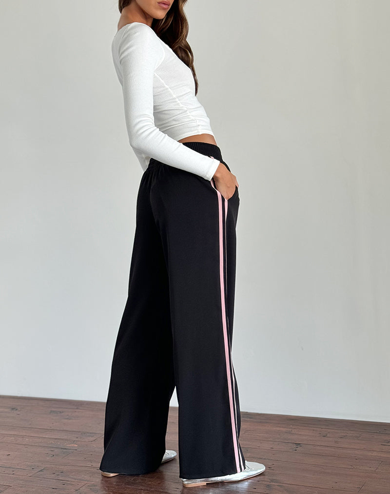 Immagine dei pantaloni Bennett in nero con strisce laterali rosa