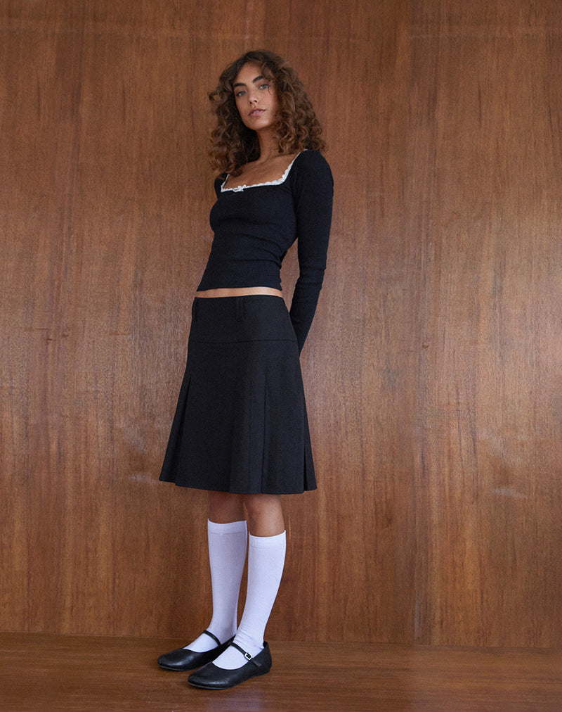 Immagine di Bovita Top a maniche lunghe in nero con finiture in bianco sporco