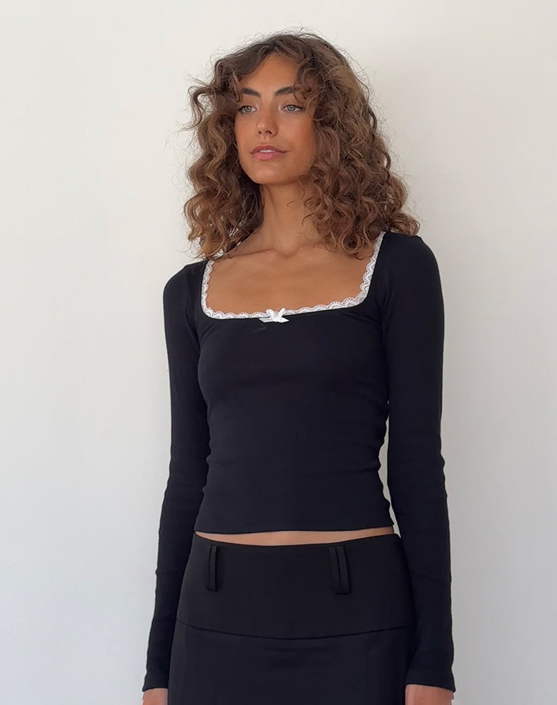 Top Bovita a maniche lunghe in nero con finiture in bianco sporco