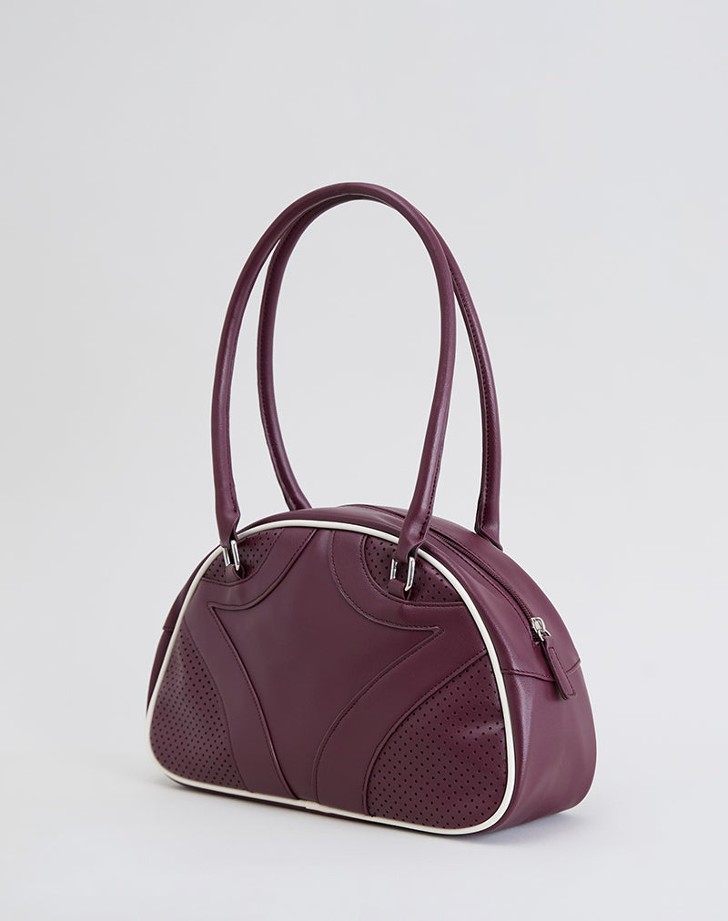 Immagine della borsa bowler in crema e borgogna