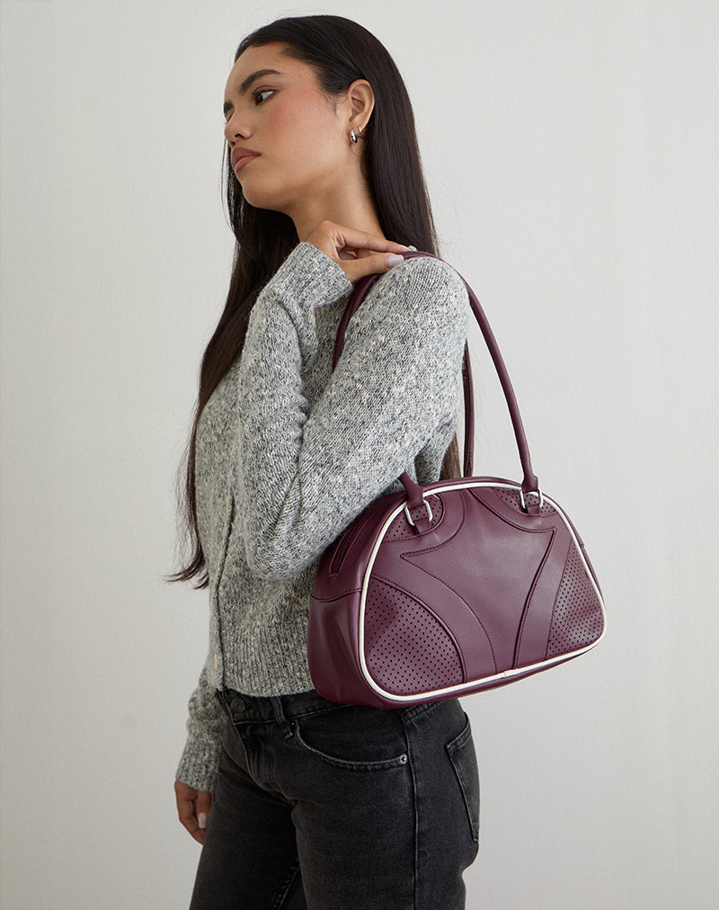 Immagine della borsa bowler in crema e borgogna