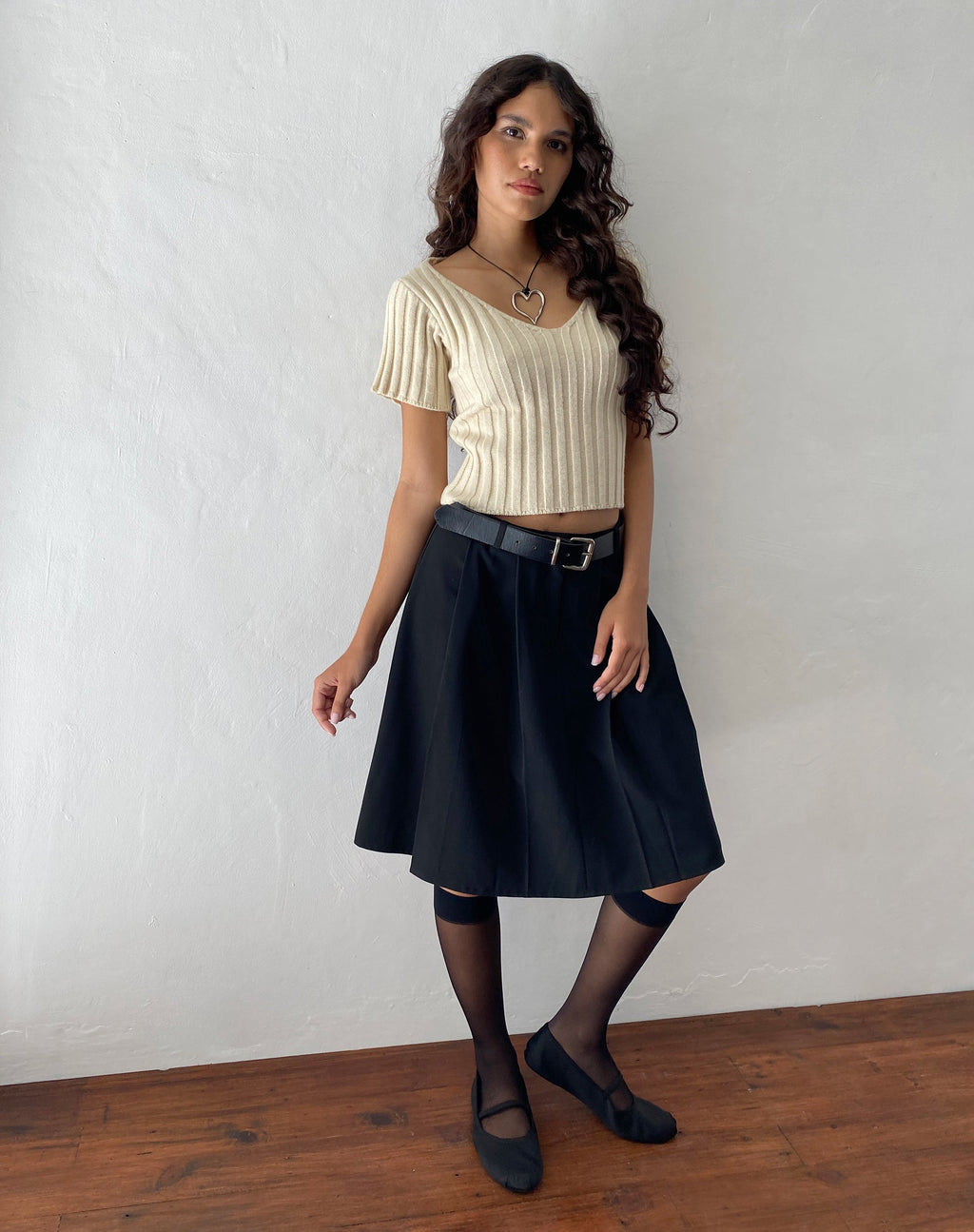 Gonna a pieghe al ginocchio Colette in nero Sartoria