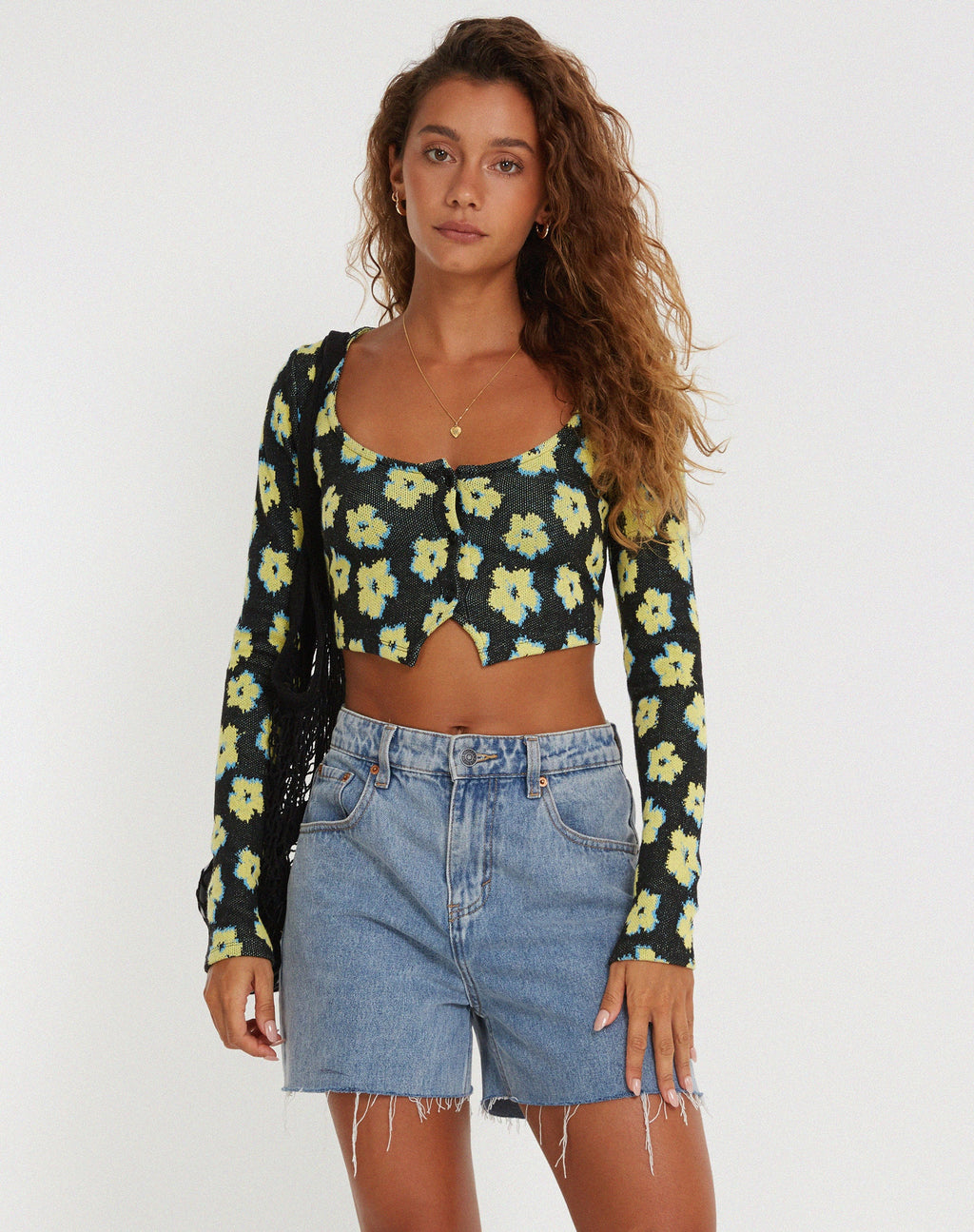 Crop top Faline in giallo e nero con motivo floreale