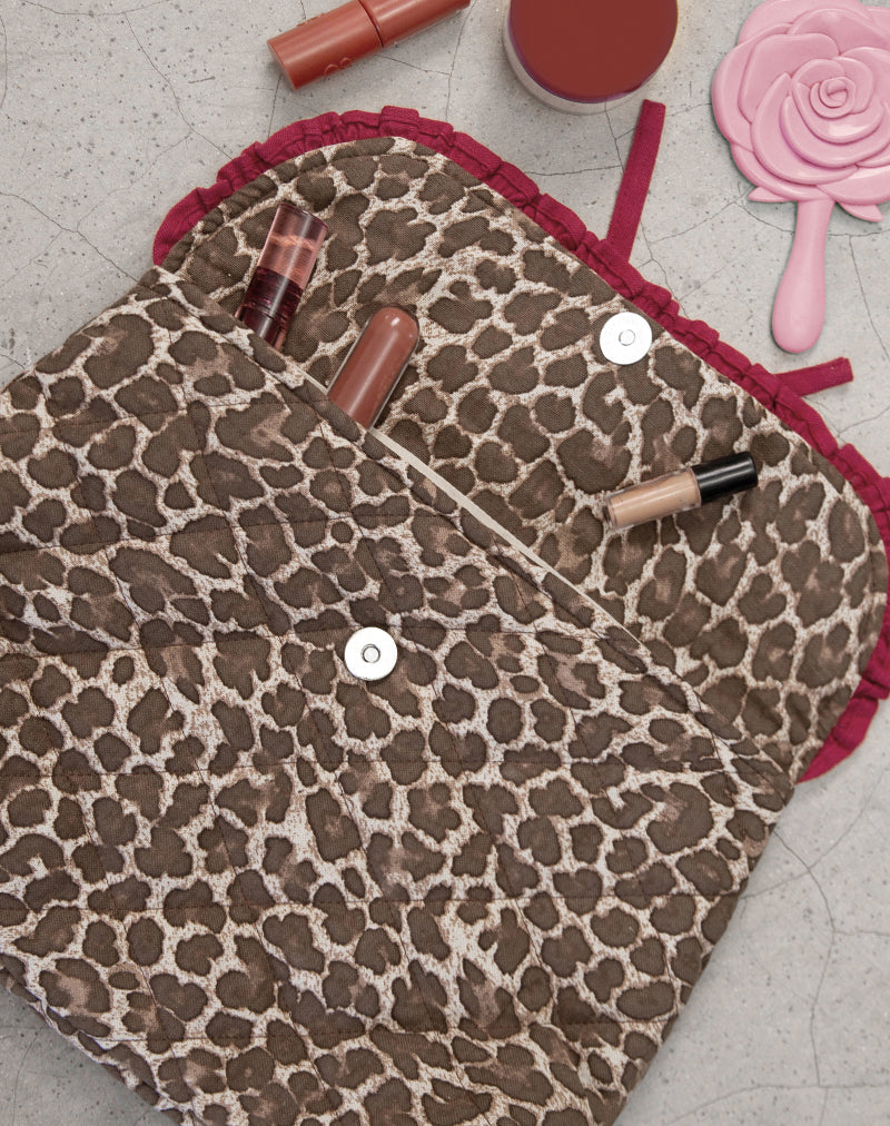 Immagine della borsa per il trucco pieghevole in leopardo con fiocco rosso