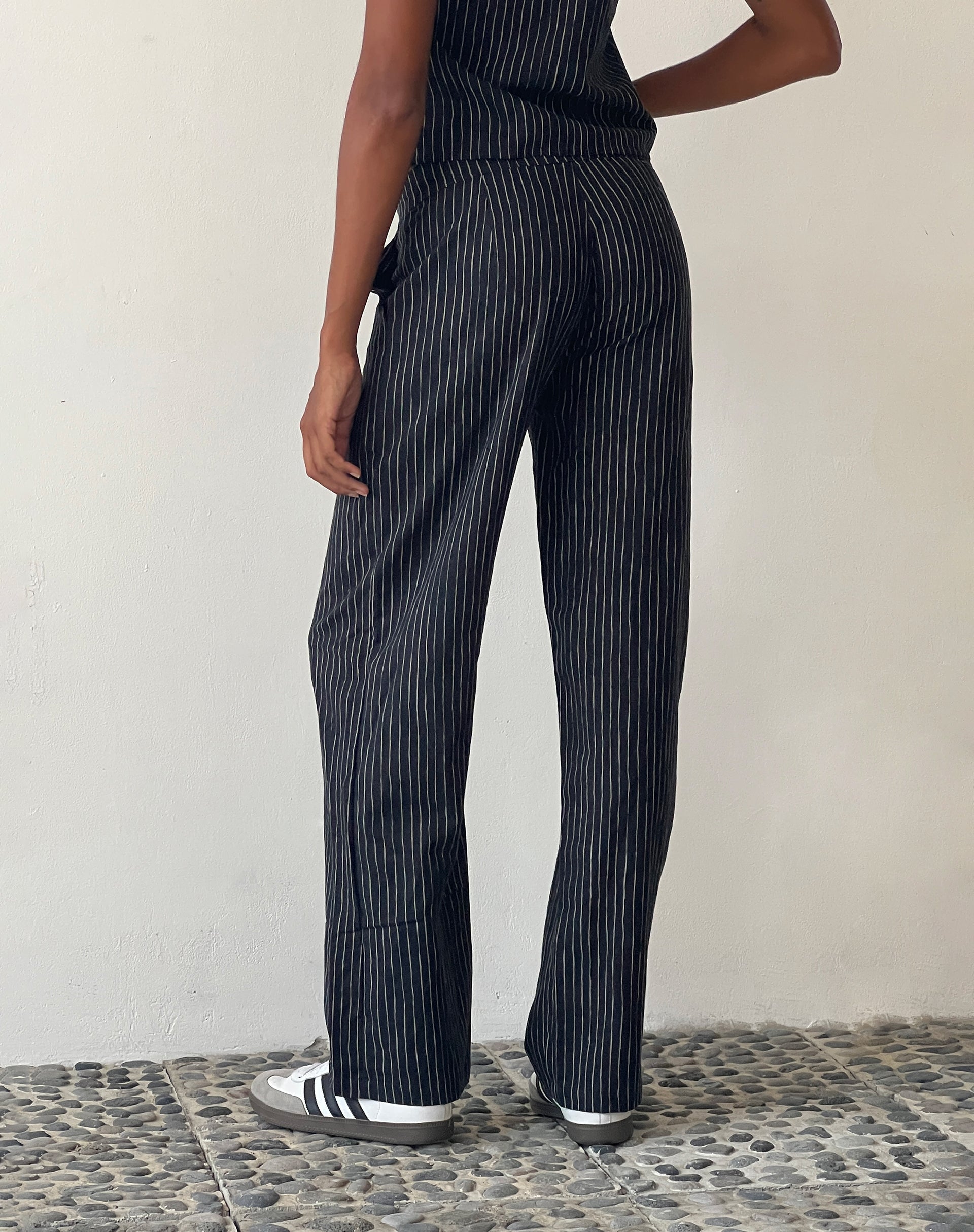 Immagine di MOTEL X JACQUIE Graba - Pantalone a gamba tesa a righe schizzate Nero