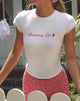Immagine di Izzy Top in bianco Strawberry Girl Script
