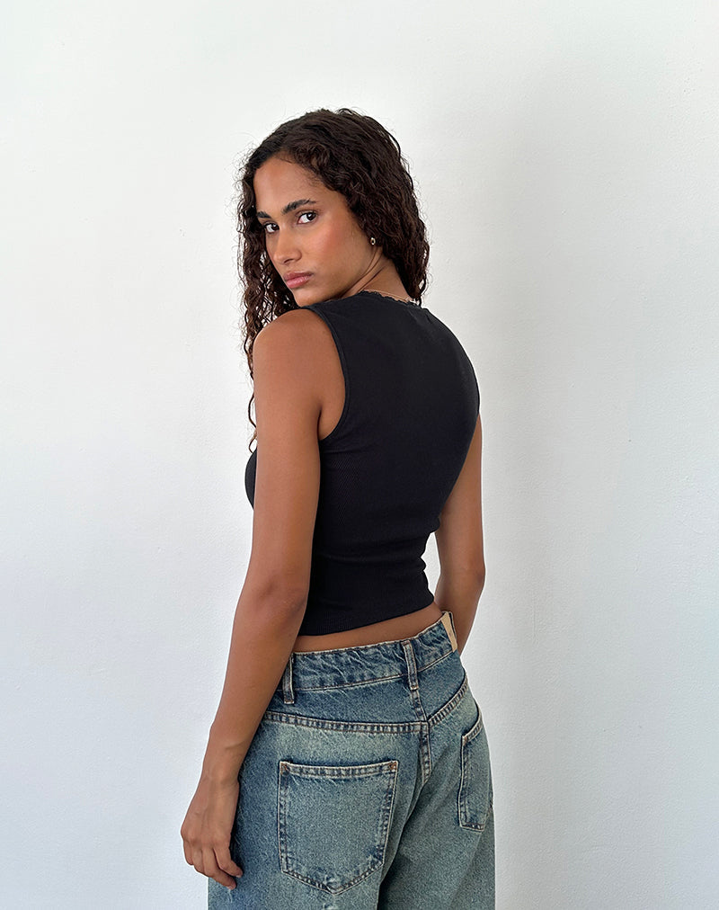 Immagine di Jinila Top nero con pizzo e fiocco