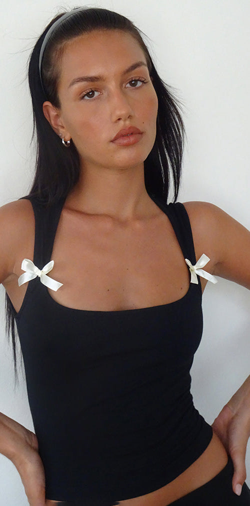 Immagine di Jiniso Crop Top nero con fiocchi avorio