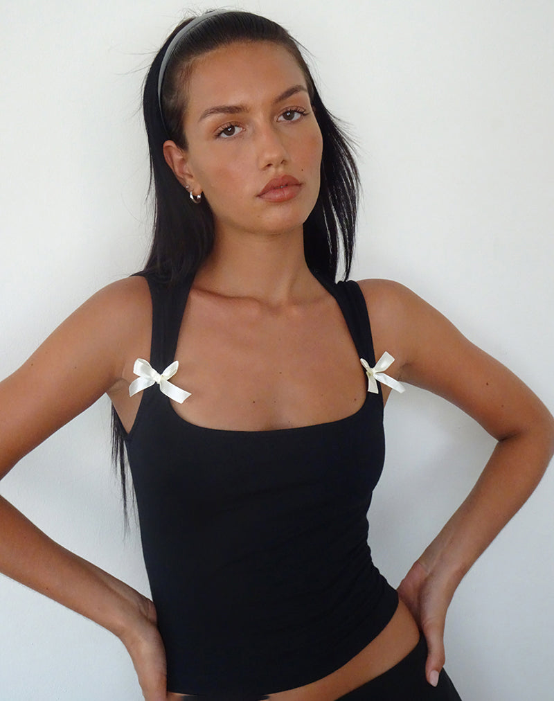 Immagine di Jiniso Crop Top nero con fiocchi avorio