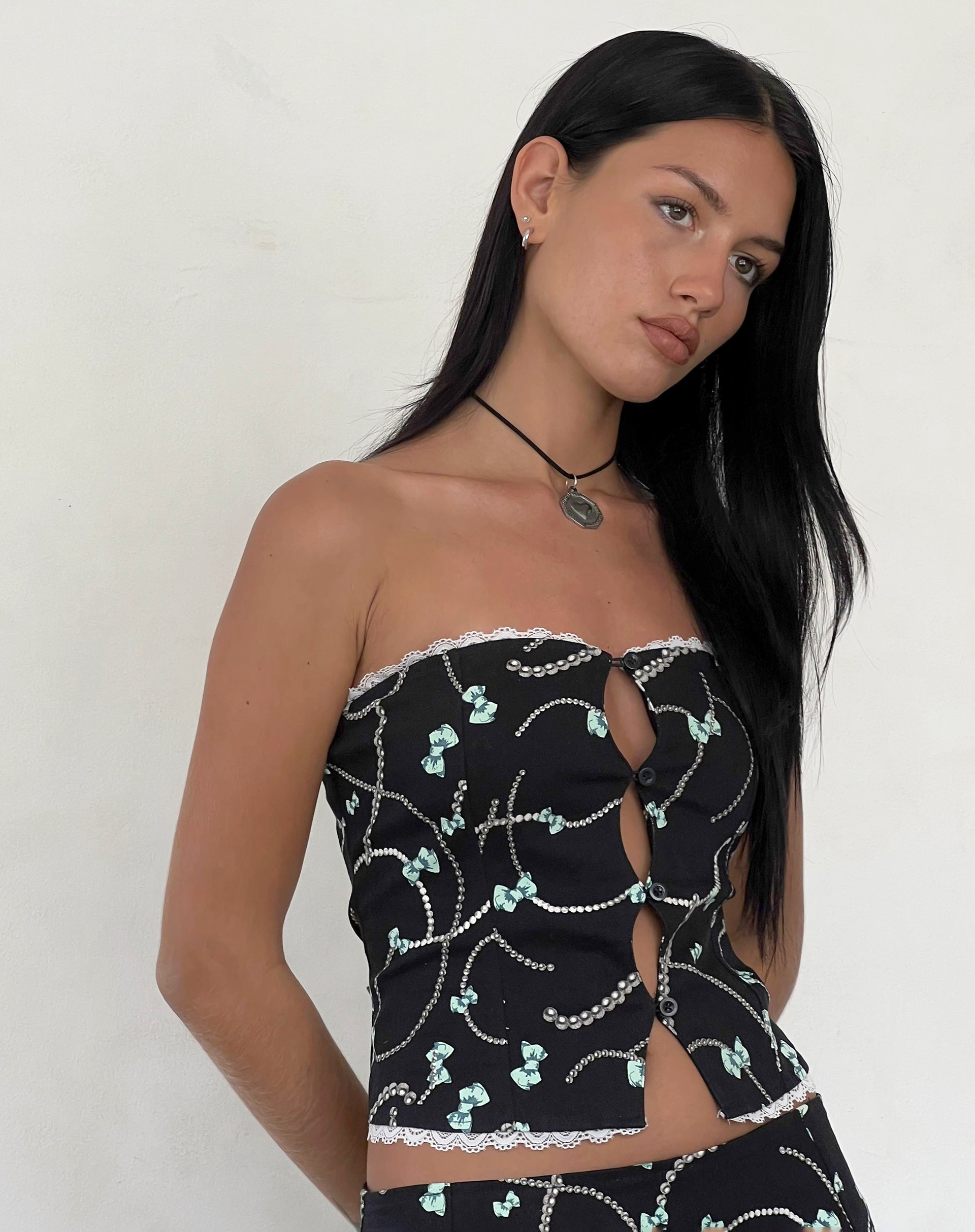 Immagine di Lacur Corsetto a fascia nero con stampa di perle e fiocchi