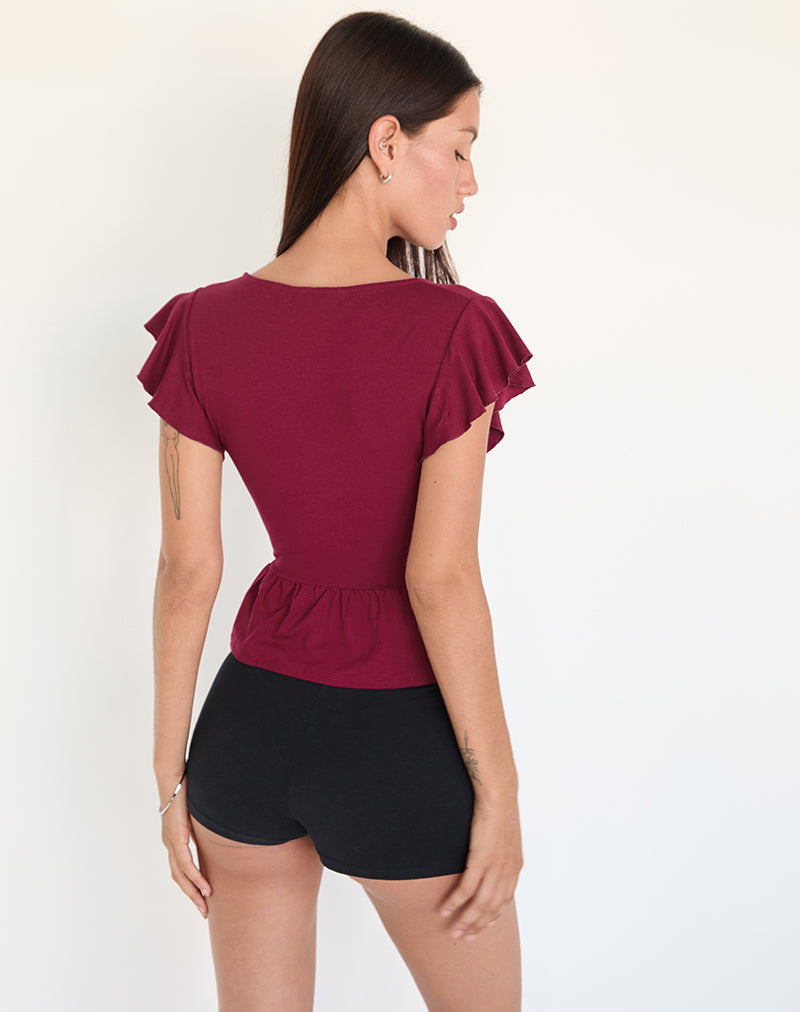 Immagine di Leisma Frill Top in Jersey borgogna con borchie