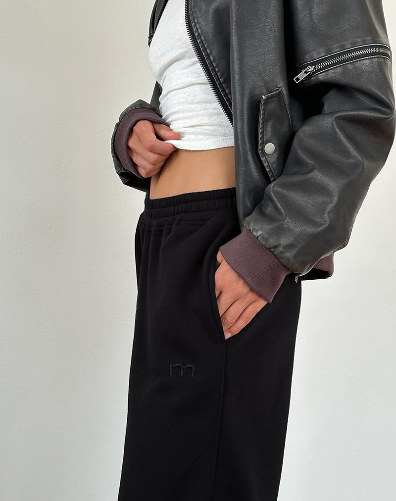 Jogger sciolti in nero con ricamo "M