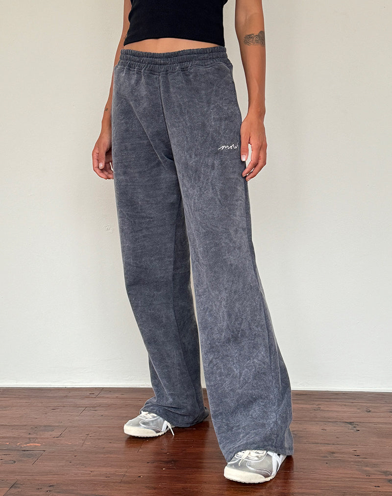 Jogger larghi in lavaggio nero con ricamo 'MOTEL' in bianco sporco