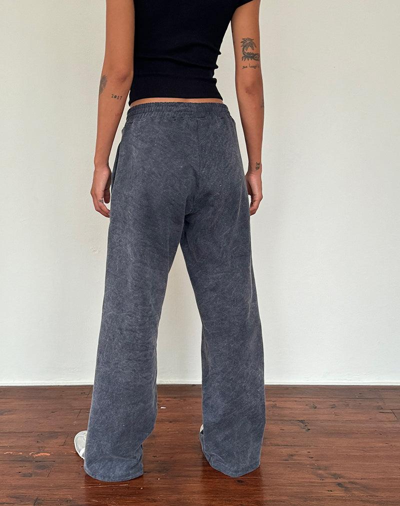 Immagine di Jogger sciolto in lavaggio nero con ricamo 'MOTEL' in bianco sporco