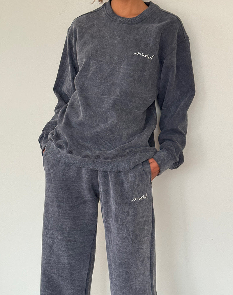 Immagine di Jogger sciolto in lavaggio nero con ricamo 'MOTEL' in bianco sporco