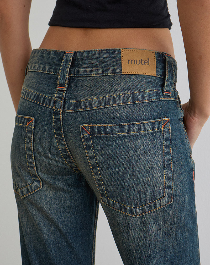 Immagine dei jeans a vita bassa con cuciture attorcigliate in verde sporco anni '80