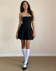 Immagine di Manisha Mini Dress in nero con rifiniture bianche