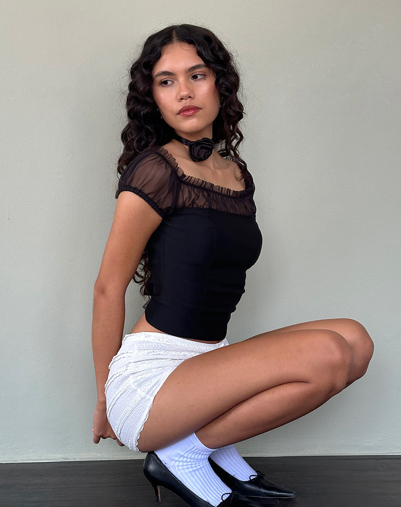 Naaji - Top Bardot con volant in chiffon - nero