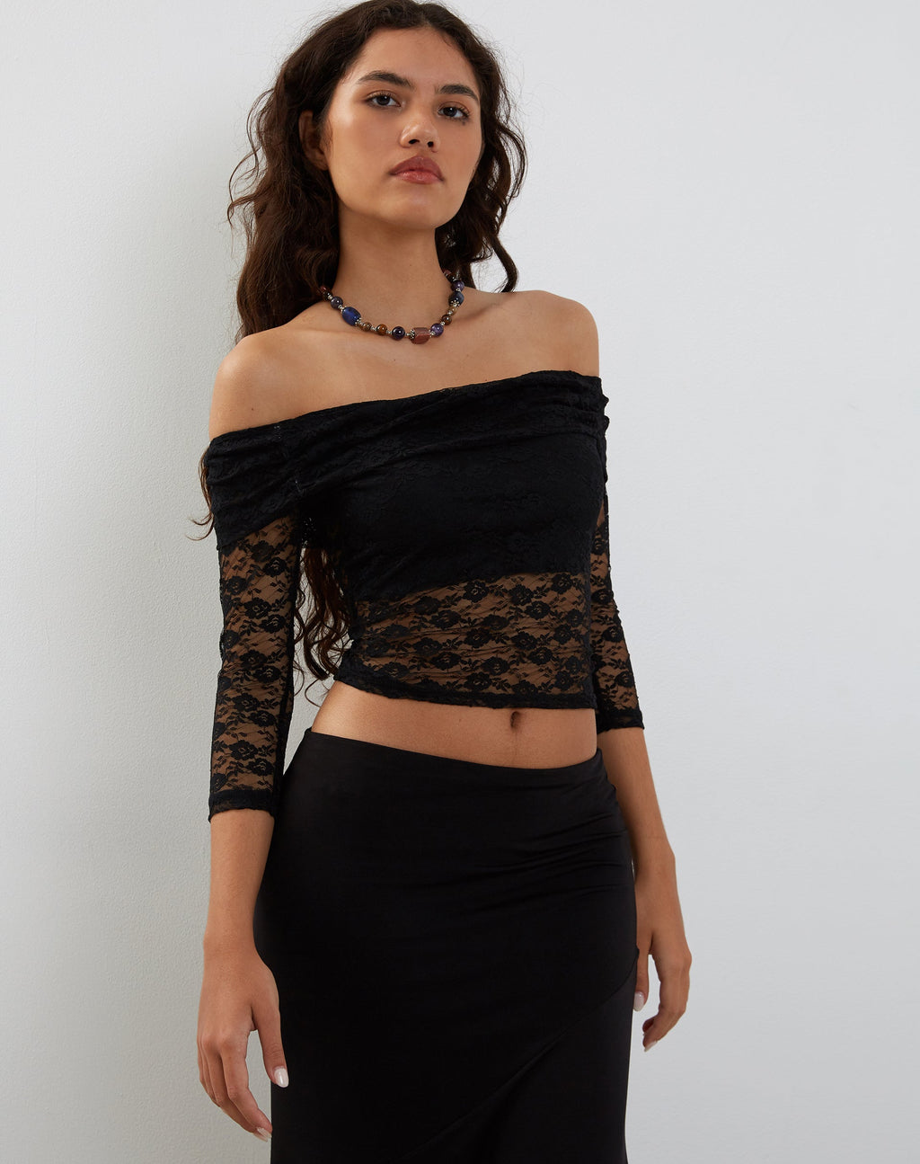 Nixie - Top Bardot a maniche lunghe in pizzo nero
