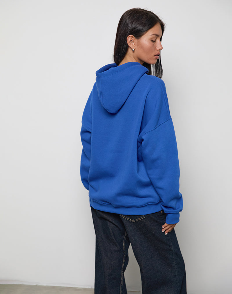 Immagine della felpa con cappuccio oversize in blu cobalto con grafica cool girl