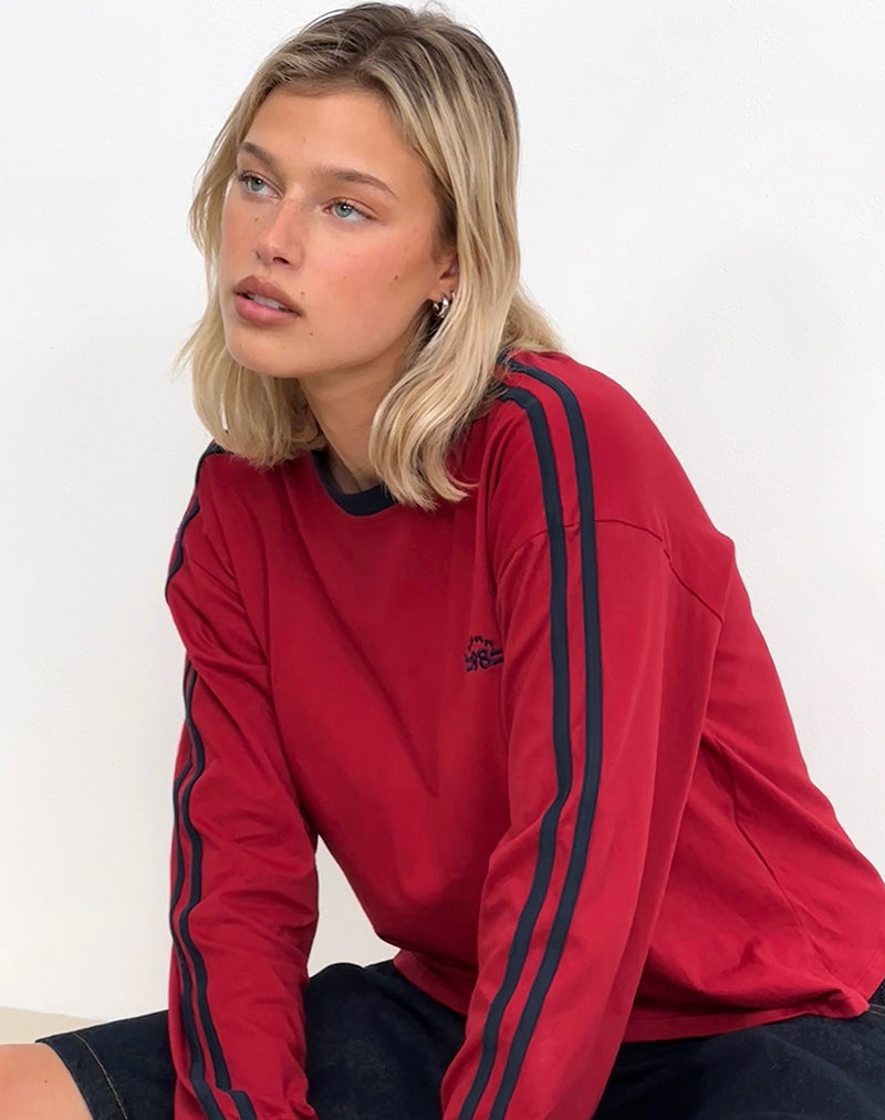 Top a maniche lunghe Prata in rosso adrenalinico con bordatura in blu