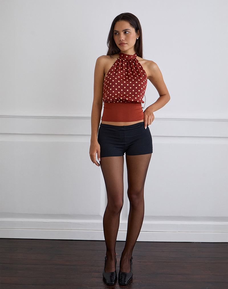 Top senza spalline Rania in rosso bruciato a pois