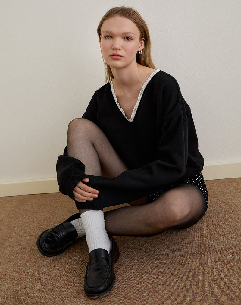 Immagine di Rodyn Jumper in nero con rilegatura a picot bianco