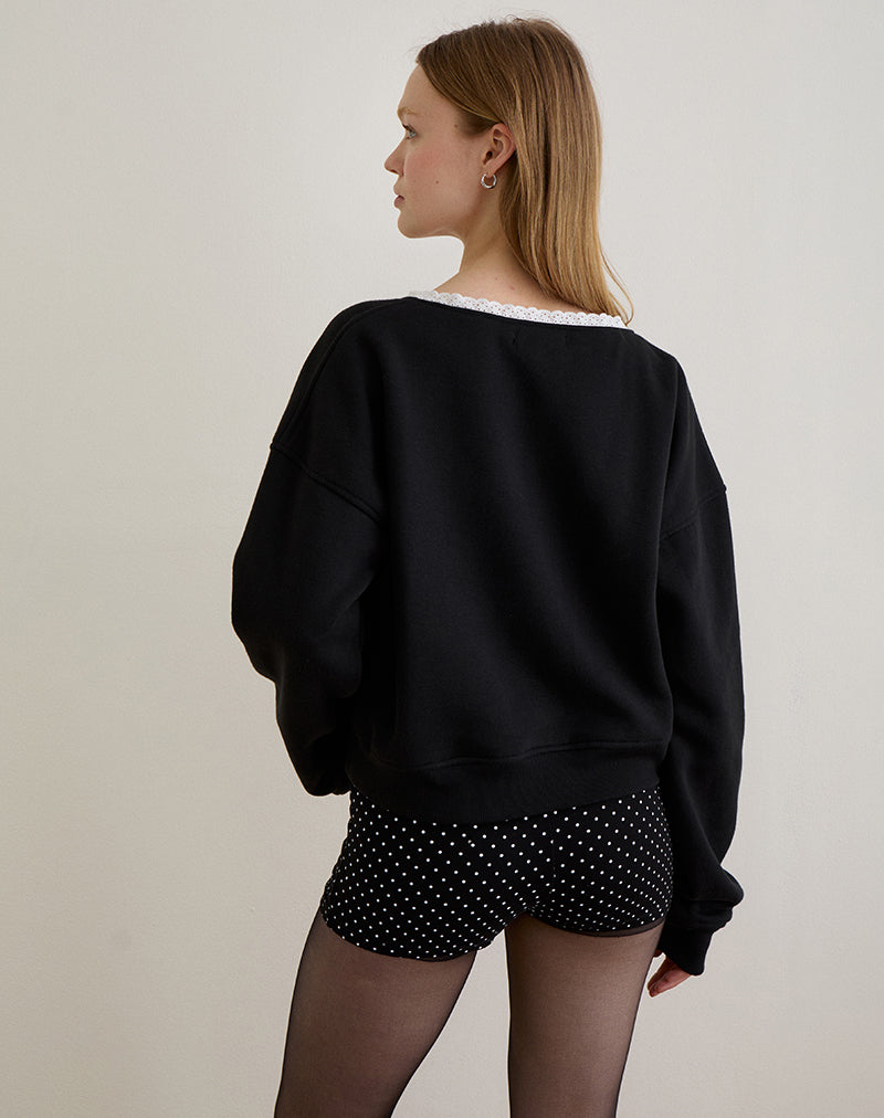 Immagine di Rodyn Jumper in nero con rilegatura a picot bianco