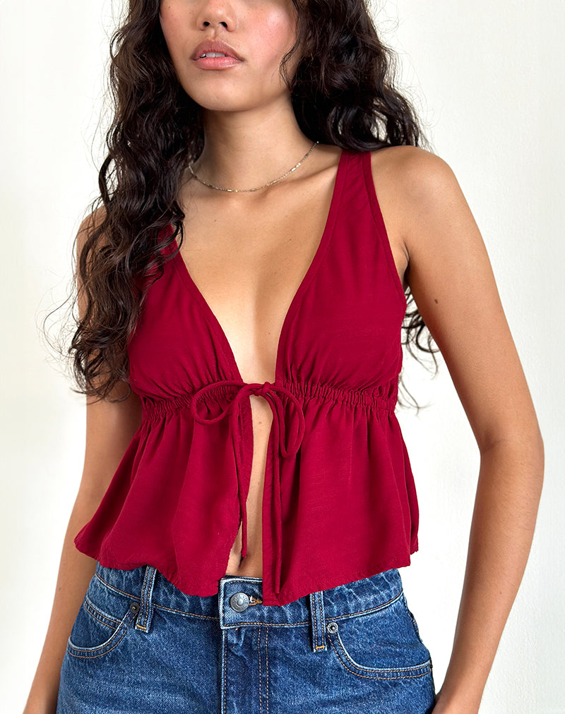 Top Rolia con laccetti in rosso adrenalinico