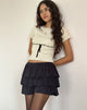 Immagine di Sabine Top in beige con rilegatura nera
