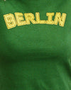 Verde olmo con rilegatura gialla e logo di Berlino