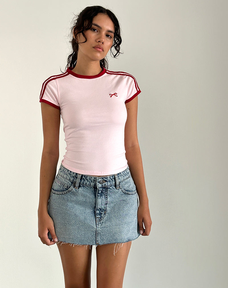 Immagine di Salda Top in rosa chiaro con ricamo fiocco e bordino rosso Adrenaline