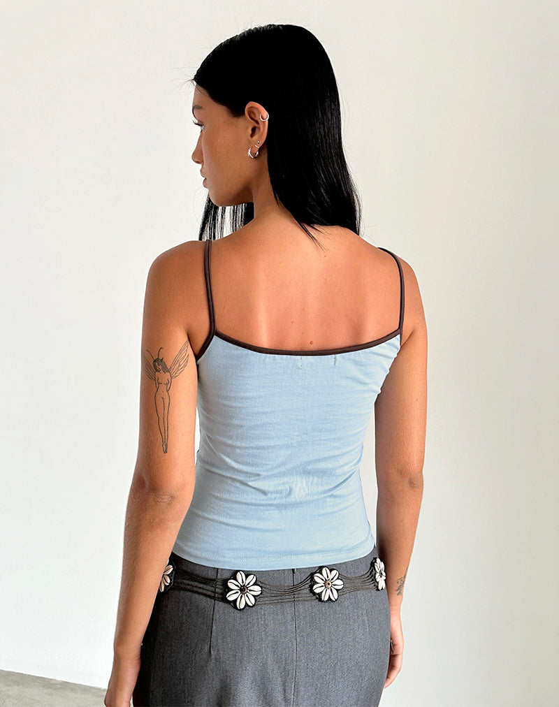 Immagine di Solani Top in Nantucket Blue con rilegatura in mogano profondo