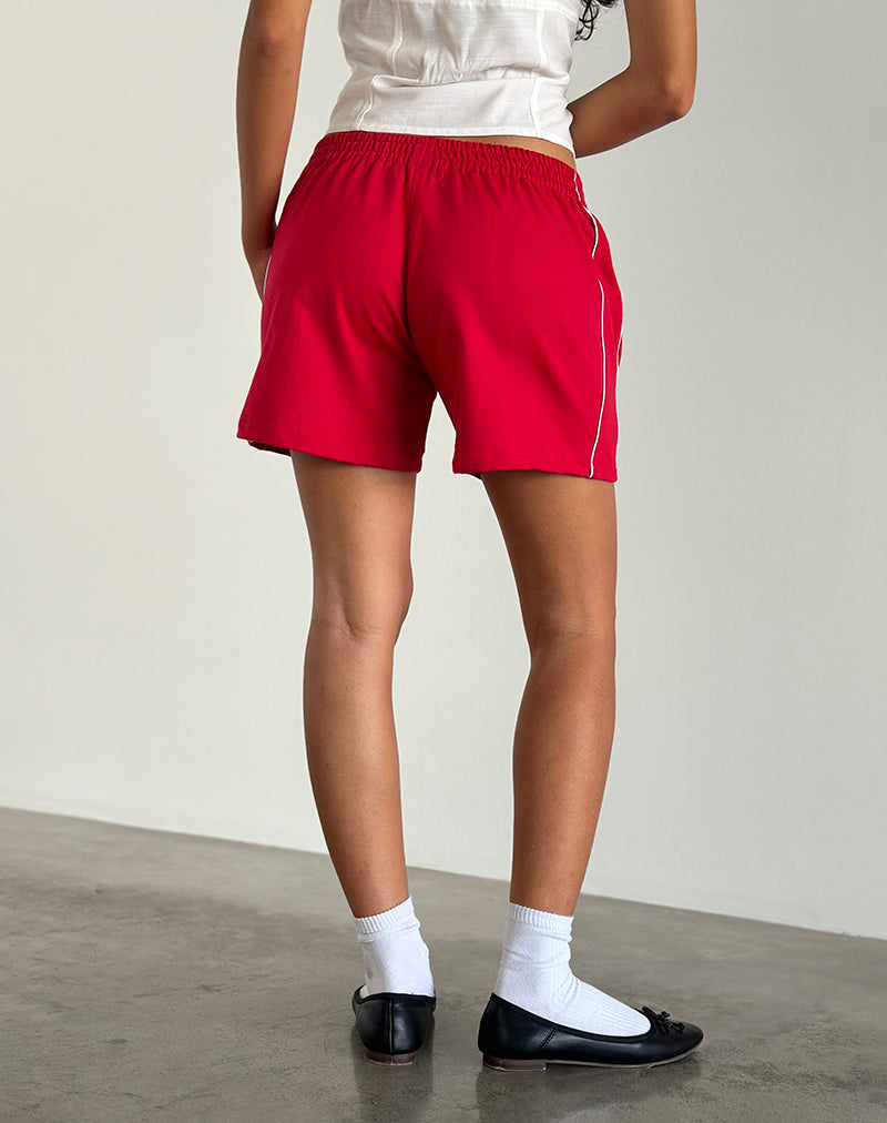 immagine dei pantaloncini Thera in rosso tango con bordino bianco sporco e logo M