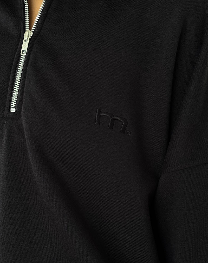 Immagine di Tirma Maglia a collo alto in nero tonale con ricamo M