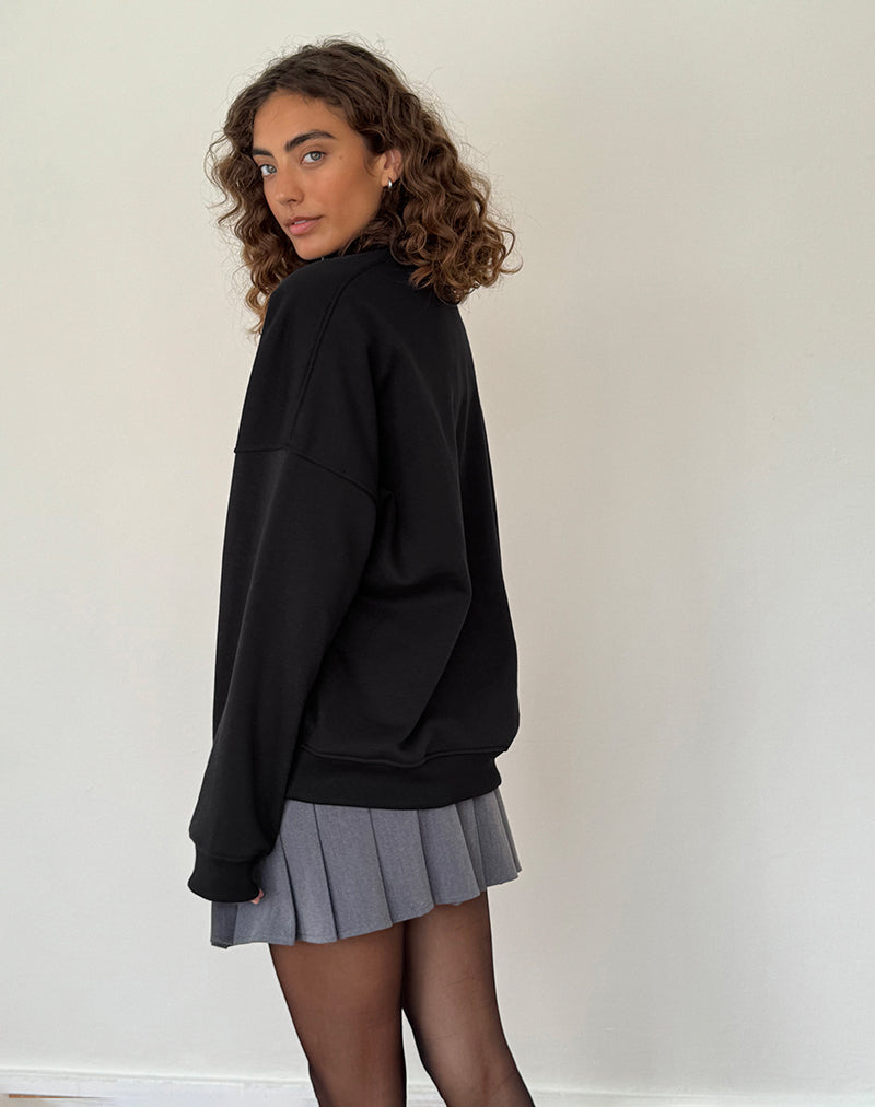 Immagine di Tirma Maglia a collo alto in nero tonale con ricamo M