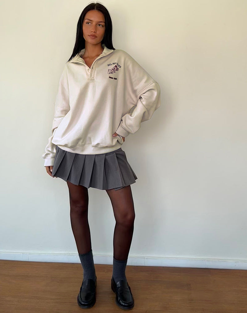 Immagine della giacca Varsity in bianco invernale con ricamo nero dello sci club