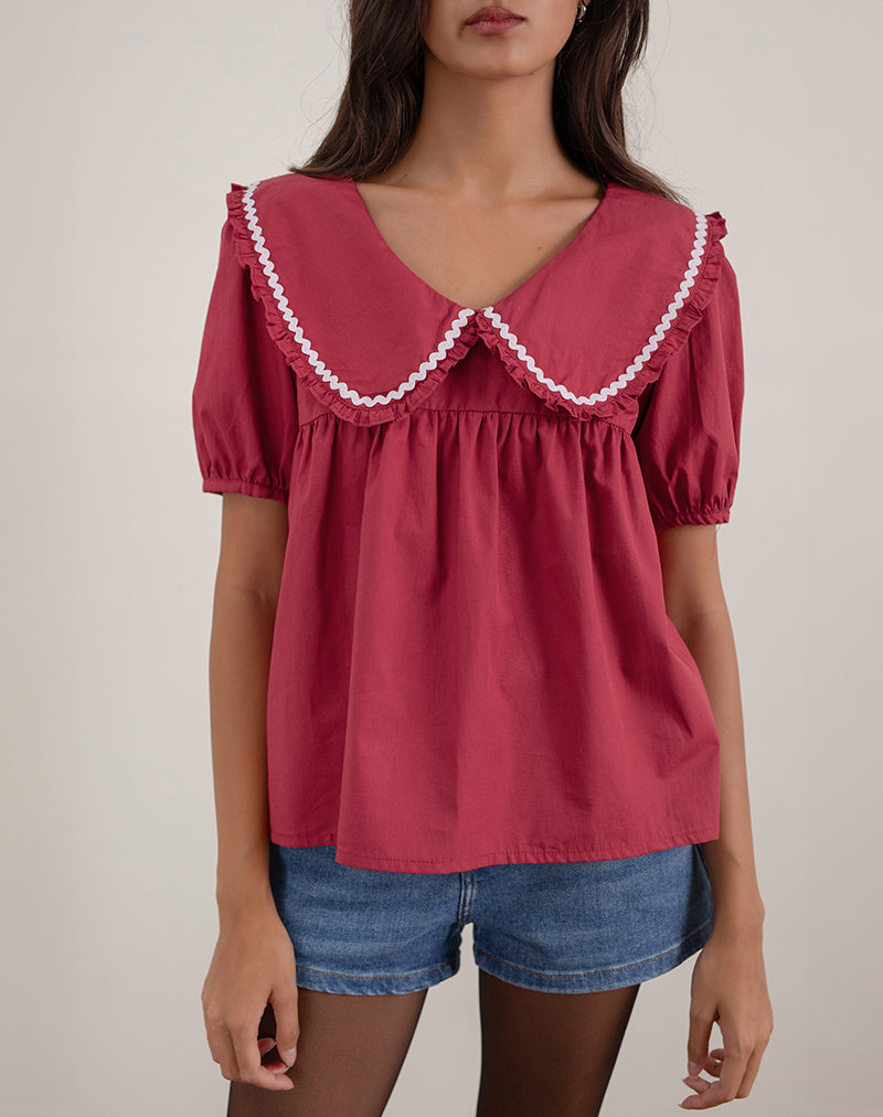 Immagine della blusa Viana in rosso adrenalinico con bordi bianchi