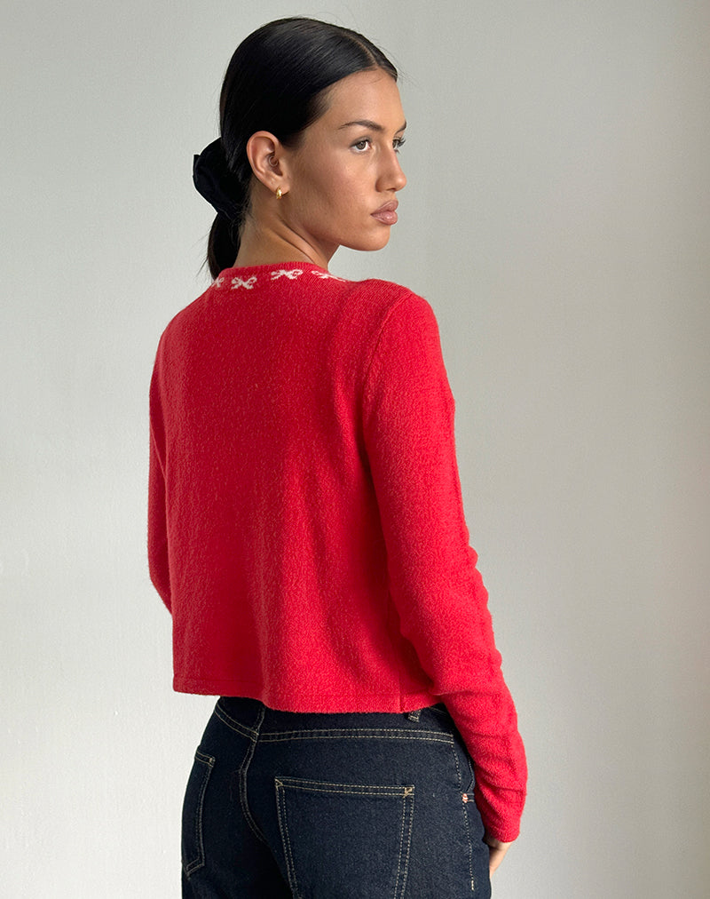 Immagine del cardigan Wunara in rosso con fiocchi rosa