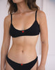Immagine del reggiseno Yanas in pointelle nero con bordo a balze