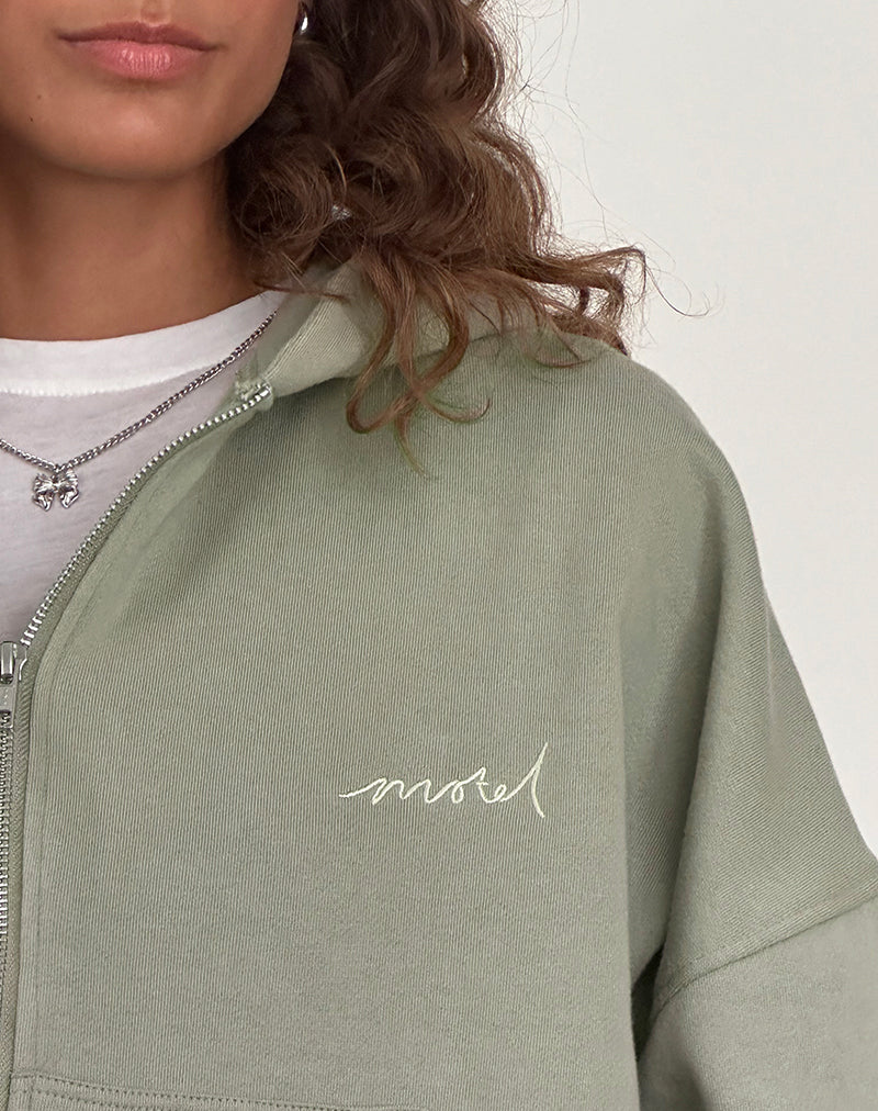 Immagine del maglione con zip in London Fog con ricamo 'MOTEL' in avorio